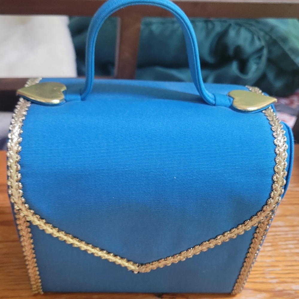 A Yves Saint Laurent top handle blue purse!